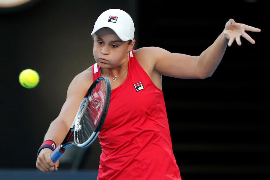 Ashleigh Barty plays a backhand return against Camila Giorgi in their second-round match at the Australian Open.