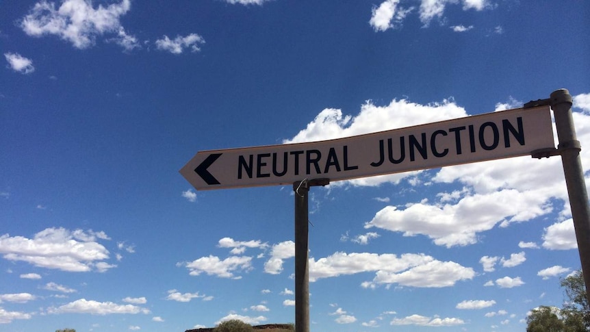 A roadside sign pointing towards Neutral Junction Station