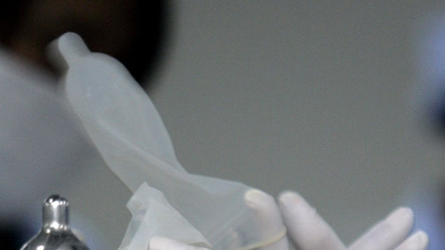 A labourer works at a condom production line in China