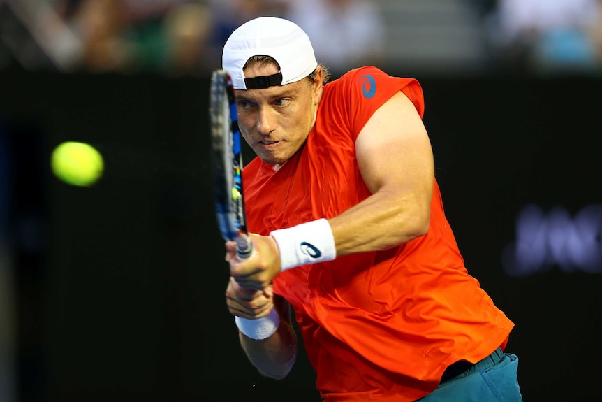 Encouraging display ... James Duckworth plays a backhand return against Lleyton Hewitt