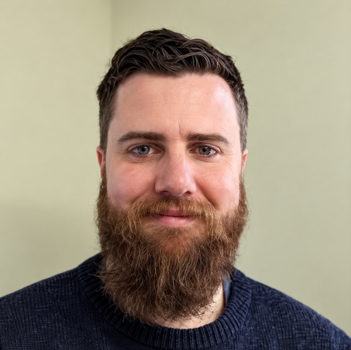 A man looks at the camera.