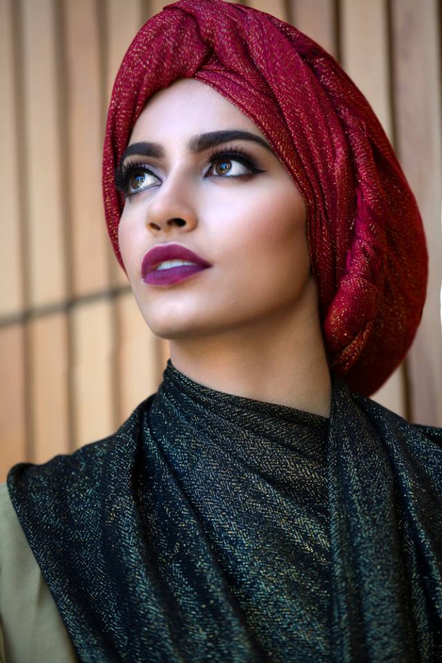 A model wearing a glamorous red hijab.