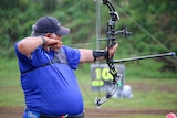 Samoa's PM Tuilaepa Sailele competing in archery at the Pacific Games