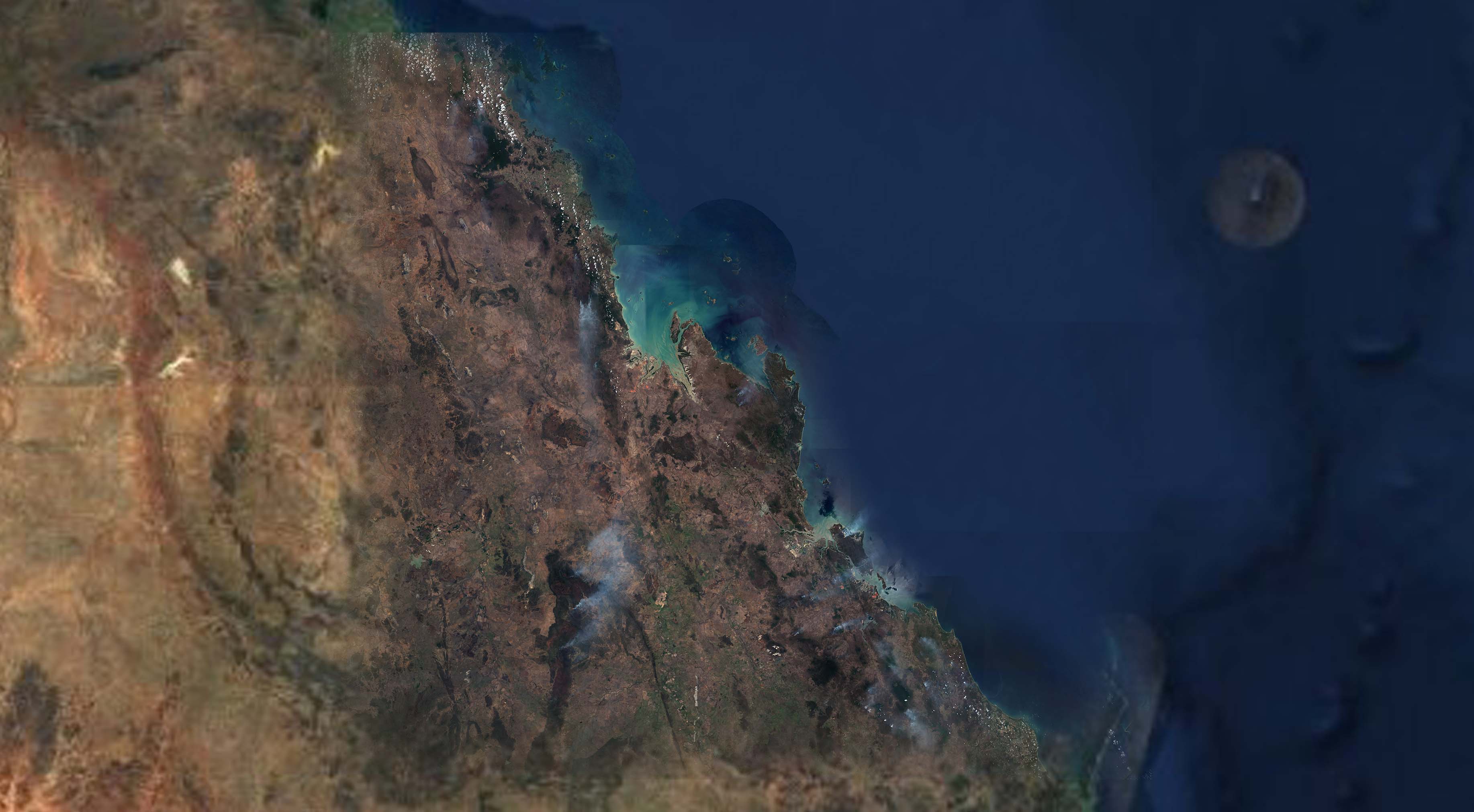 Plumes of smoke stretching across Queensland
