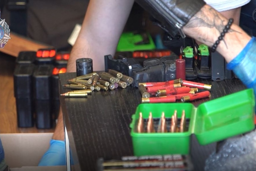 Rifle and shotgun ammunition spread out on a table