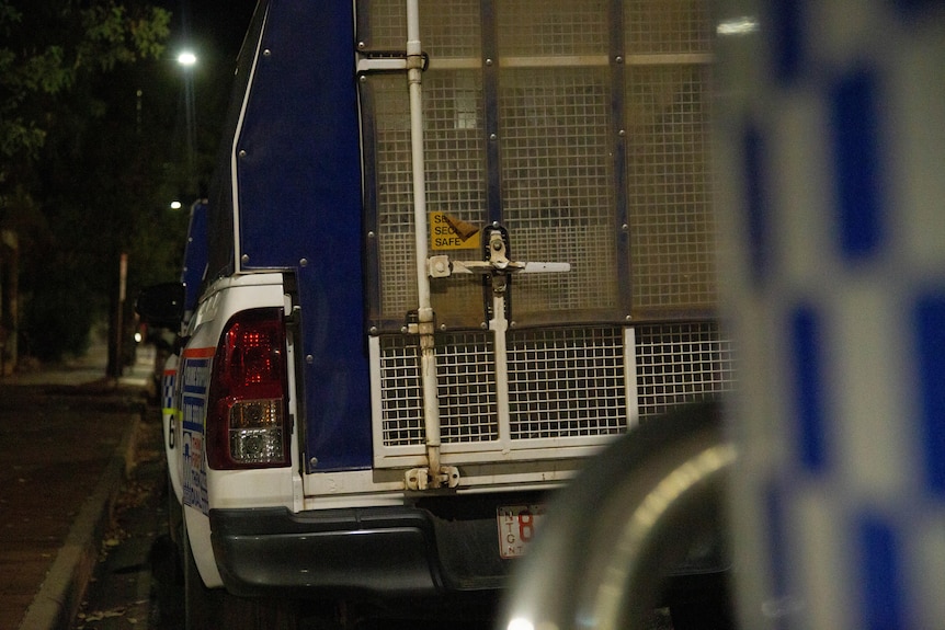 NT Police vehicle parked in Alice Springs at night.