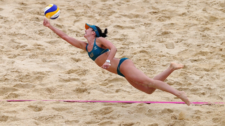 Louise Bawden tries desperately to keep a ball in play against Germany.