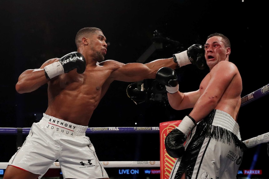 Boxer Anthony Joshua jabs Joseph Parker in the side of the face
