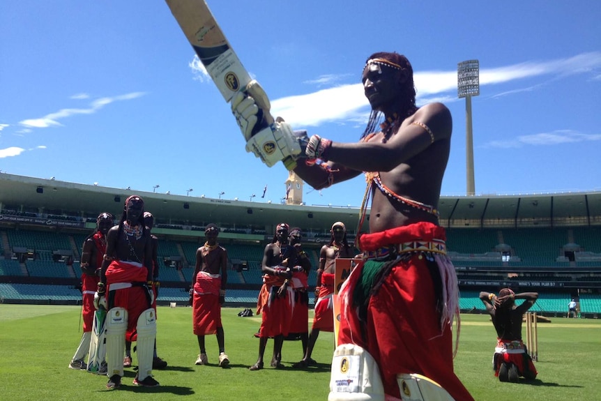 Maasai dancer wields a cricket bat at the SCG