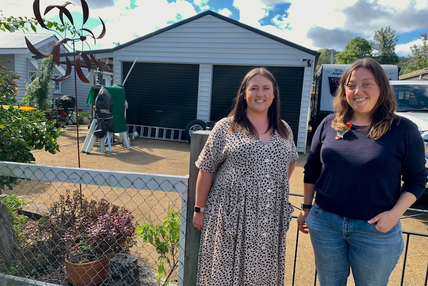 Two ladies leading new Canungra arts hub standing in front of the double shed set to be their headquarters