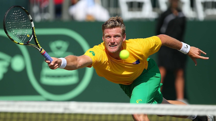 Sam Groth stretches for a volley in his Davis Cup dead rubber