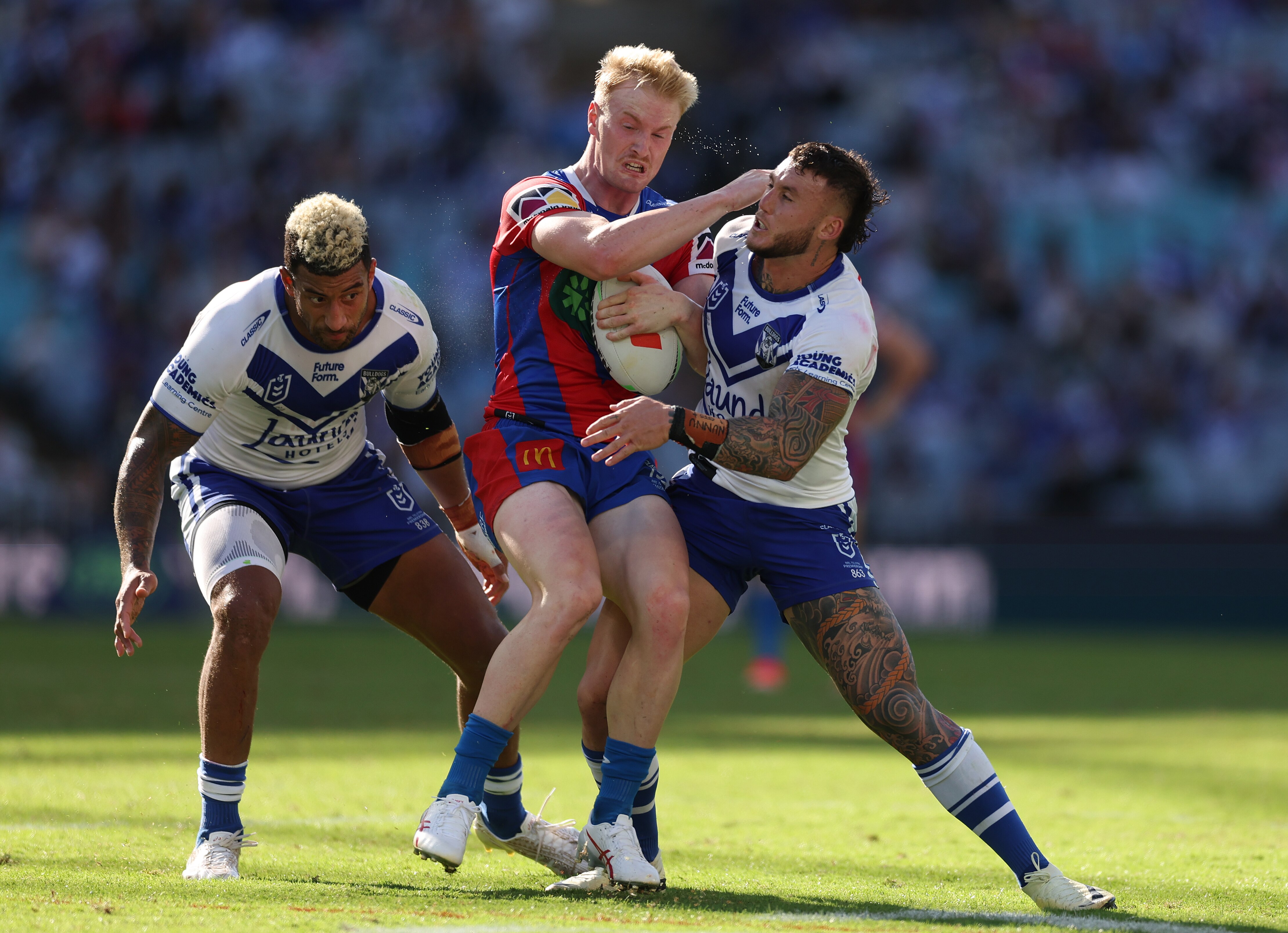 A man is tackled in a rugby league match 