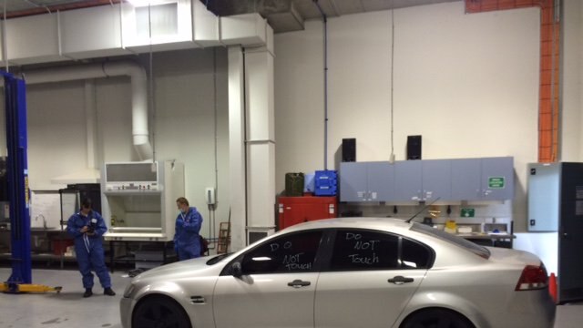 A sliver car in a workshop.