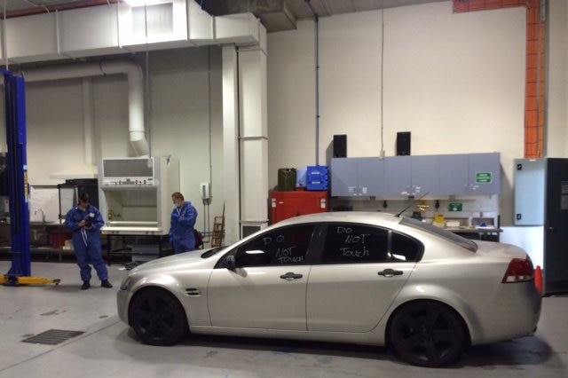 A sliver car in a workshop.