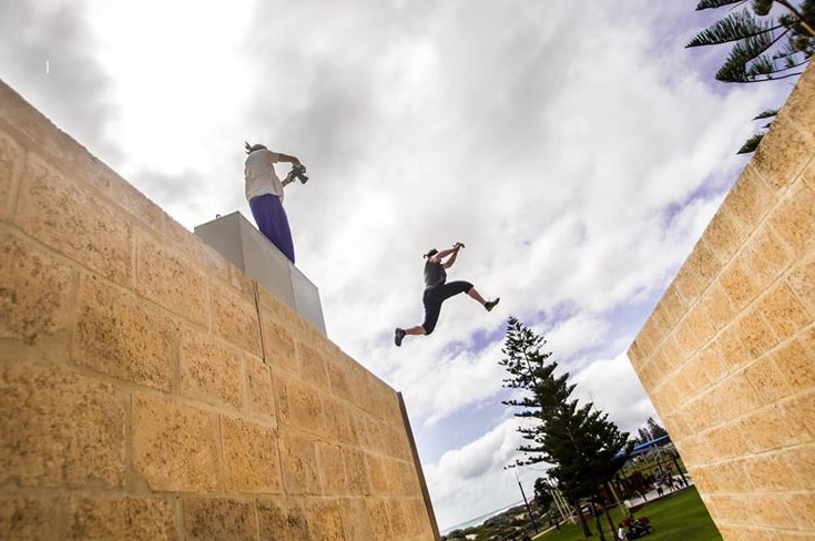 A parkour leap between walls