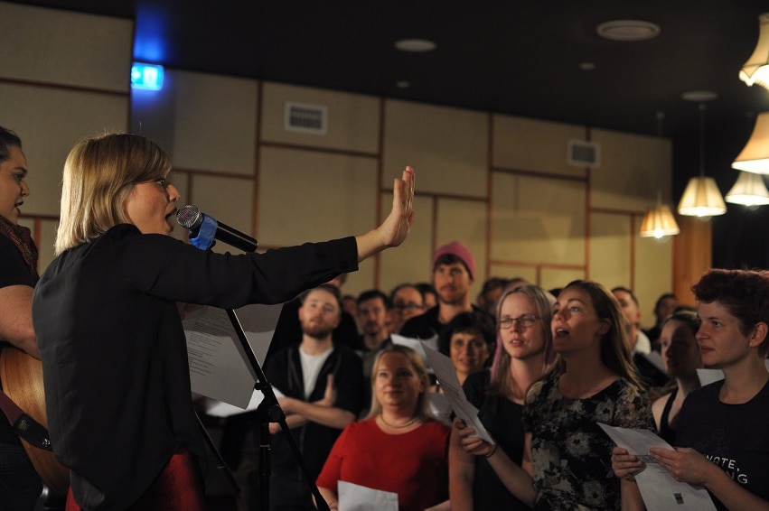 Choir Conductor Astrid Jorgensen conducts the pub choir