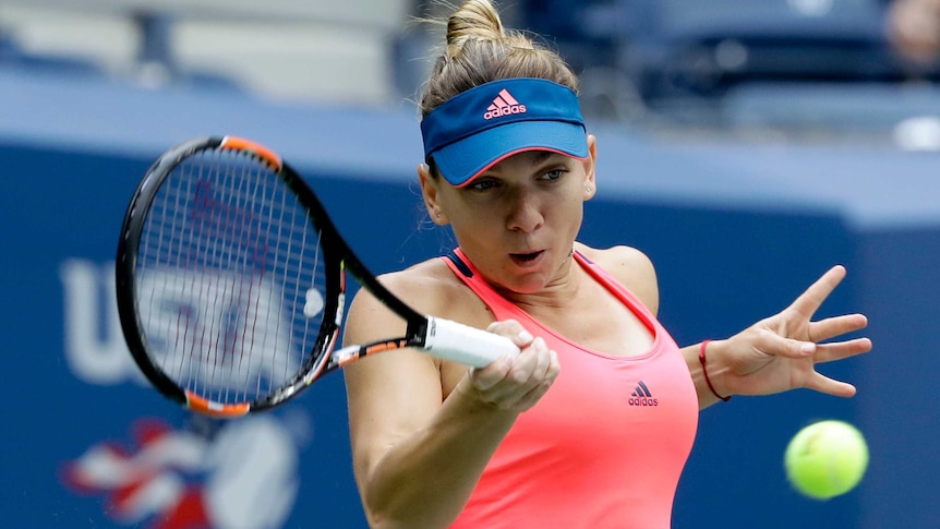 Romania's Simona Halep hits a return to Belgium's Kirsten Flipkens in the 2016 US Open first round.