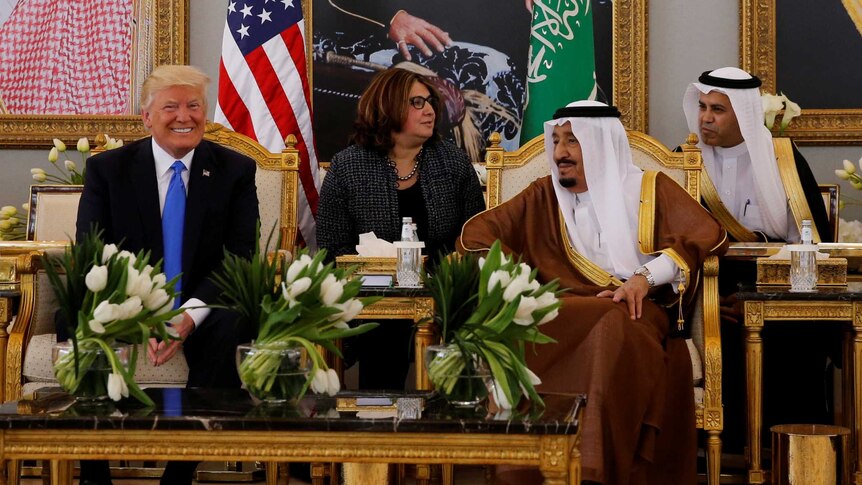 Saudi Arabia's King Salman bin Abdulaziz meets with US President Donald Trump during a reception ceremony.