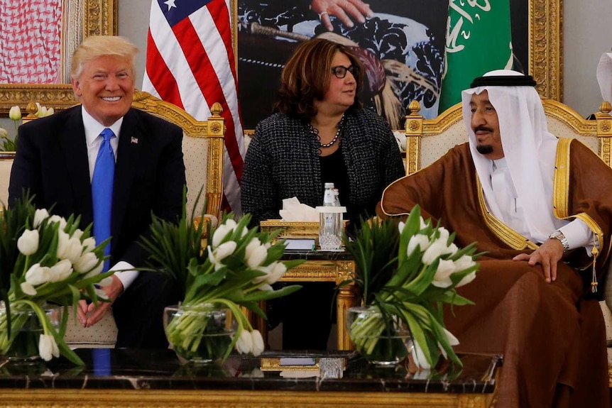 Saudi Arabia's King Salman bin Abdulaziz meets with US President Donald Trump during a reception ceremony.