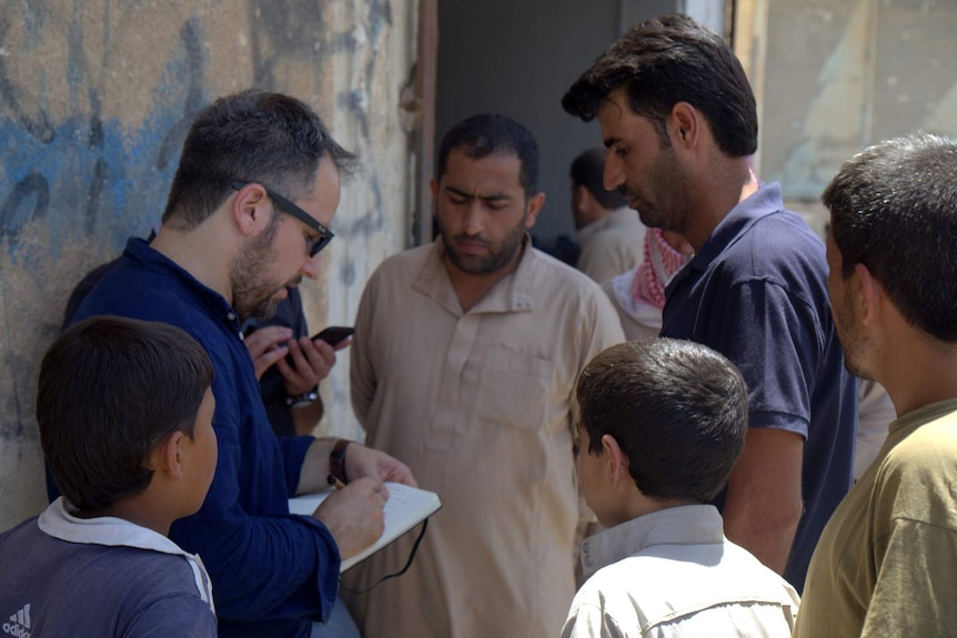 Human Right Watch investigators talk to locals in Syria