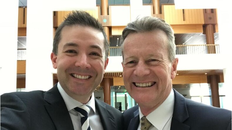 Two smiling men in a selfy,