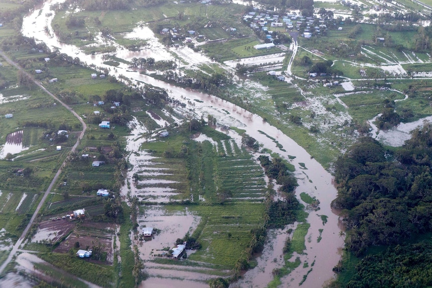 Aerial photo of widespread flooding across farmland in Fiji.