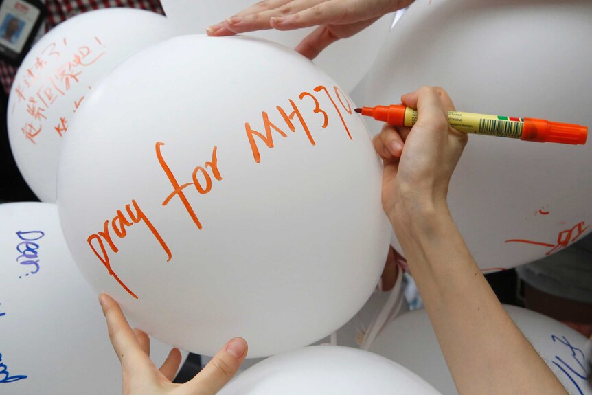 Malaysia Airlines pray for MH370