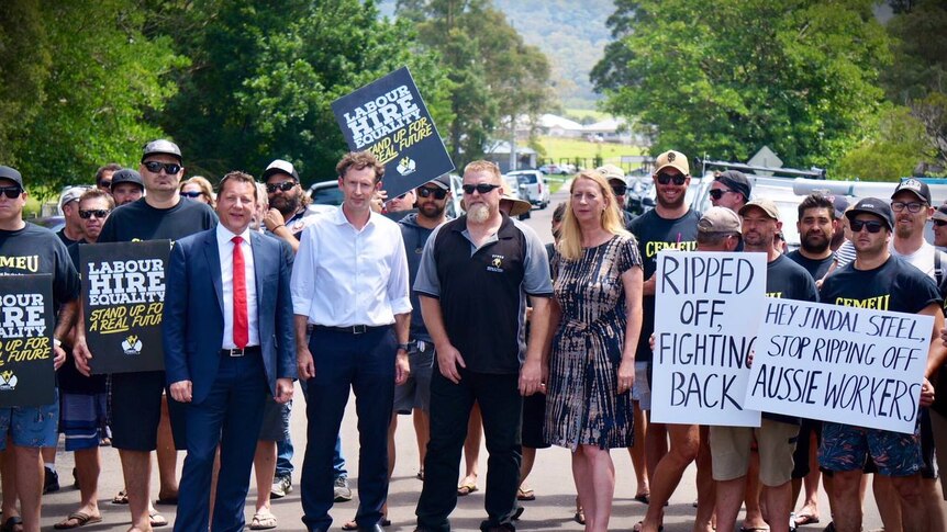 Labor MPs Paul Scully, Stephen Jones and Sharon Bird stand alongside CFMEU members picketing with signs at Wongawilli Colliery