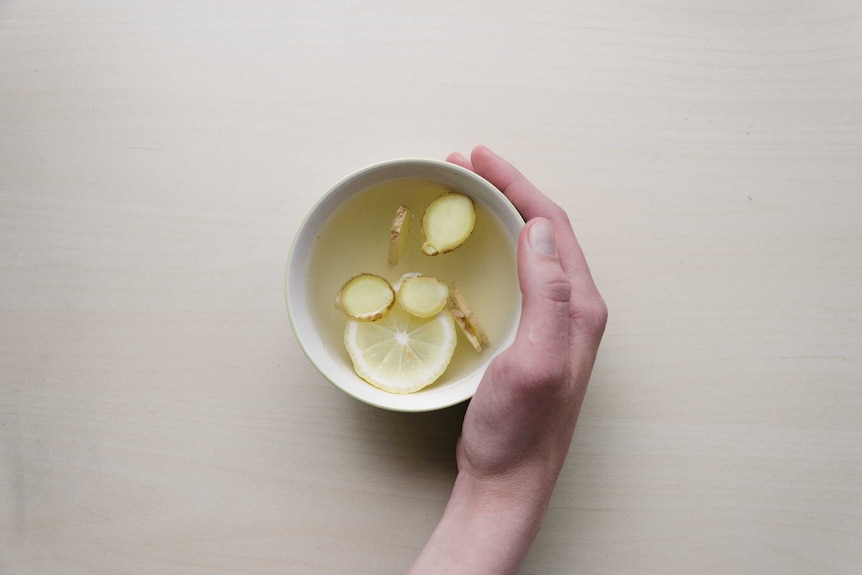 A cup of tea with sliced ginger and lemon. Ginger has become an increasingly popular ingredient in beverages hot and cold.
