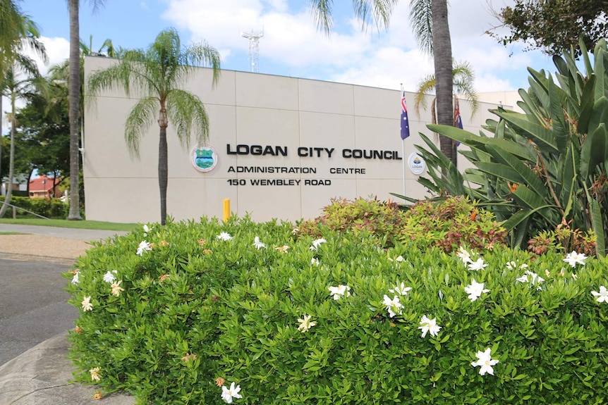 Signage of Logan City Council at main administration building with garden in view on Wembley Road at Logan City.