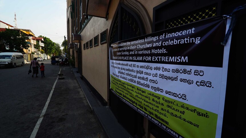 A large banner reads: 'We condemn the senseless killings of innocent Christians at worship in their Churches'.