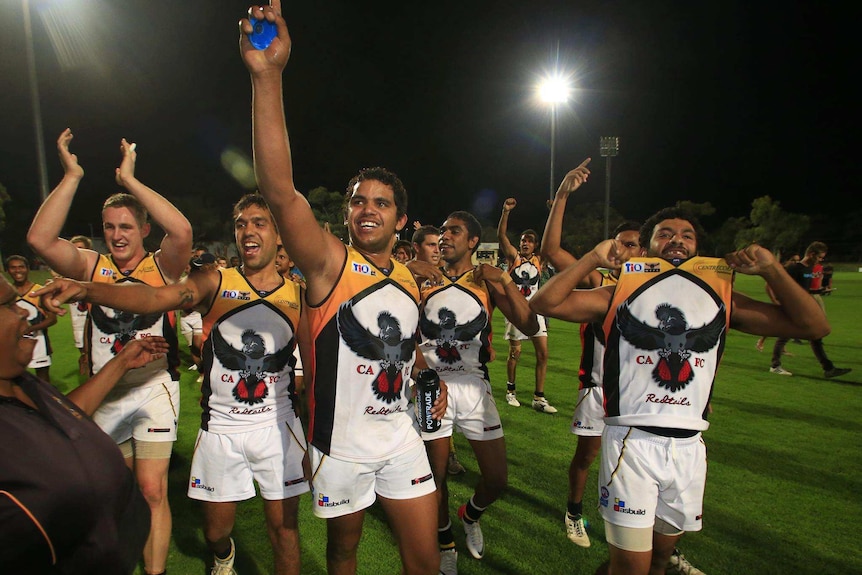 Central Australian Redtails celebrate after a 2013 NTFL game in Darwin.