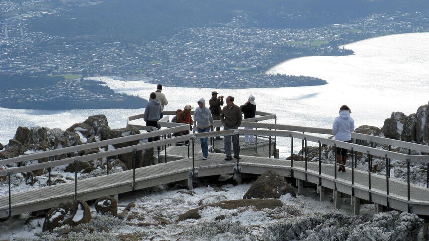 Tourists brave the snow on Mount Wellington, Hobart