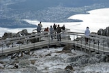Tourists brave the snow on Mount Wellington, Hobart