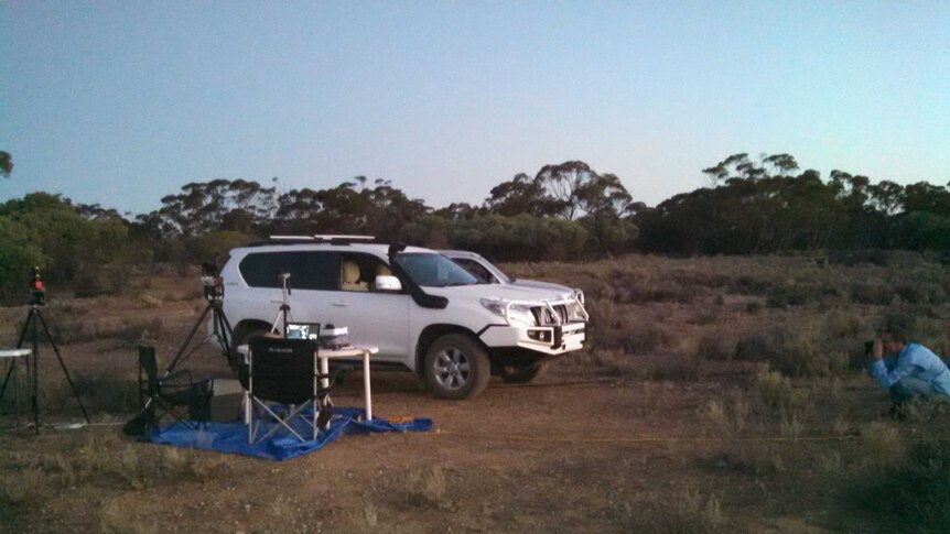 Vehicle parked next to dark sky measuring equipment in Yookamurra Sanctuary.