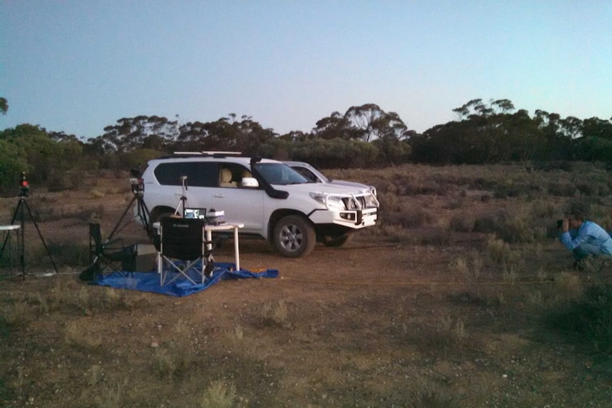 Vehicle parked next to dark sky measuring equipment in Yookamurra Sanctuary.