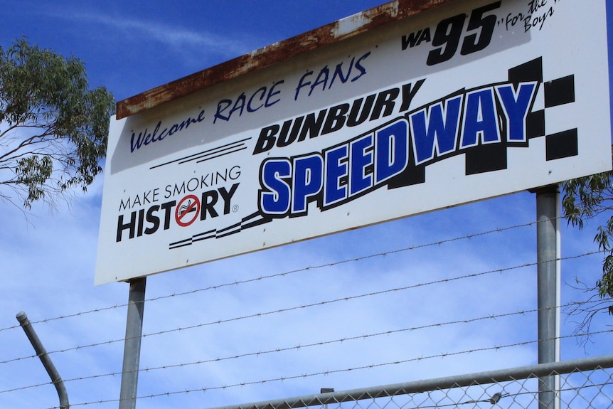 A sign with Bunbury Speedway,  and Welcome Race Fans and a checkerboard sign