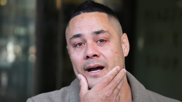 A close up of Jarryd Hayne with his hand on his chin