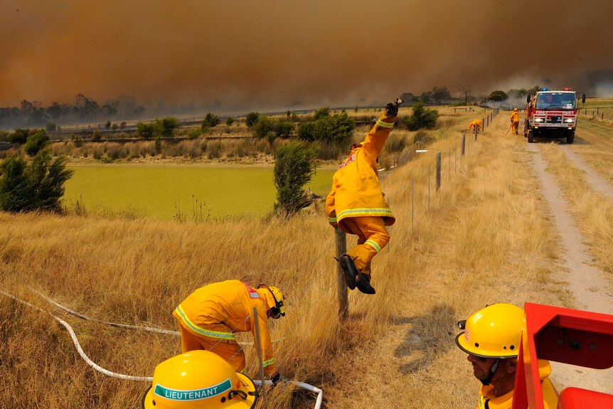 firefighters out on the land fighting a fire