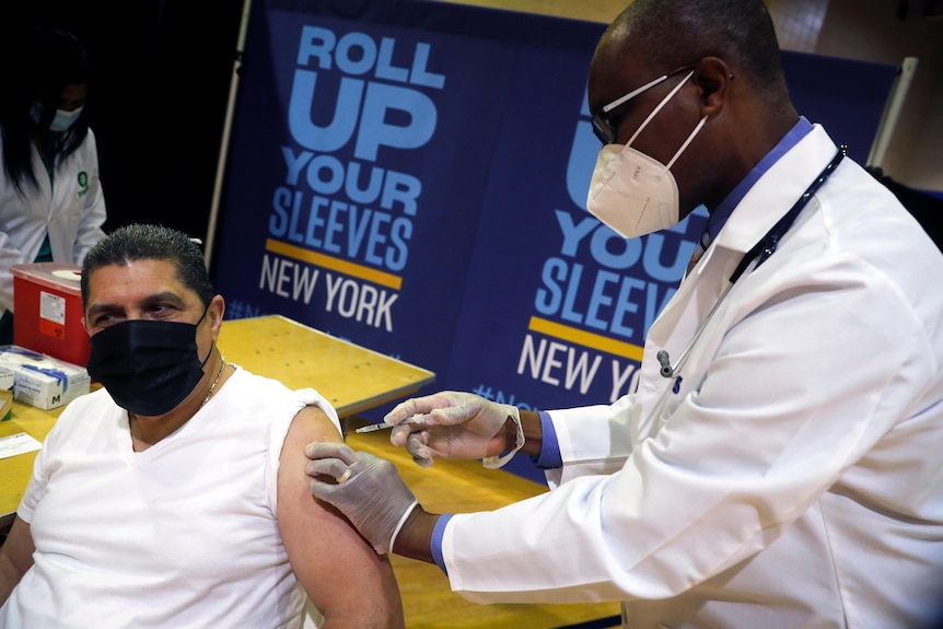 A man receives a Pfizer coronavirus vaccination shot