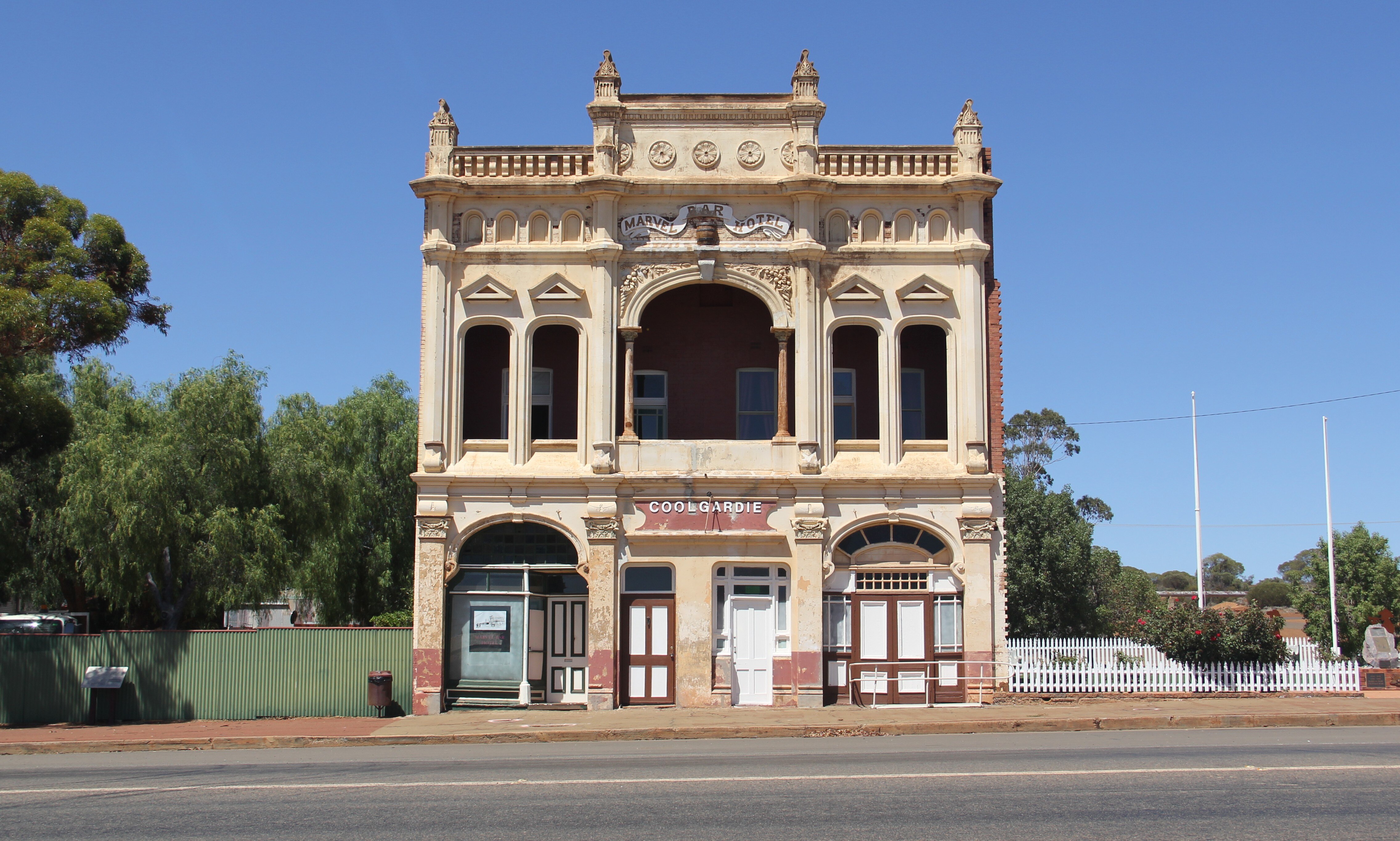 An historic brick building with ornate columns. 