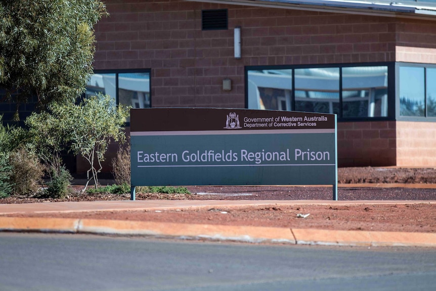 A sign at the entrance to a jail.