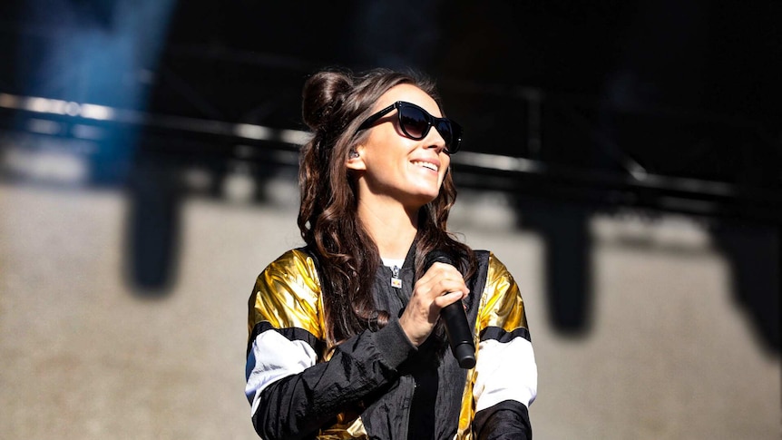 Amy Shark on stage singing at Splendour in the Grass