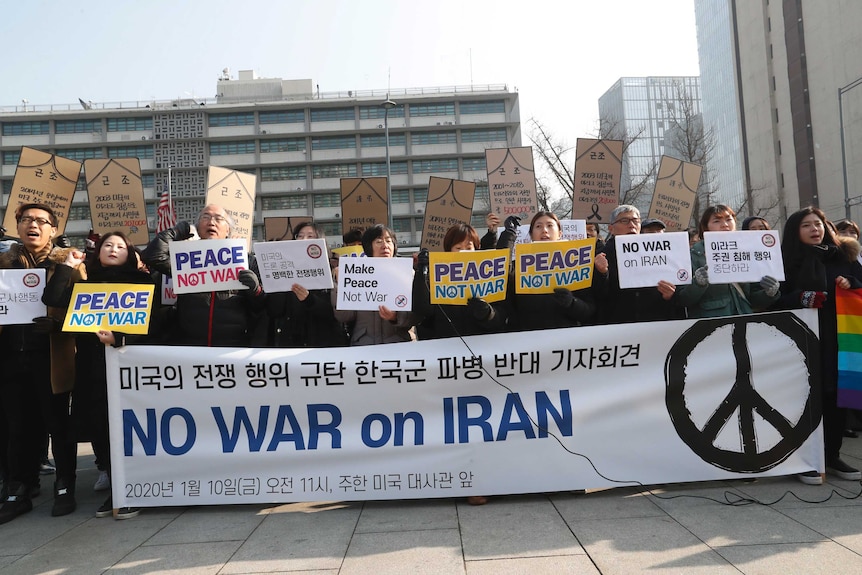 South Korean protesters stage a rally to denounce a recent US attack on Iran outside the embassy.