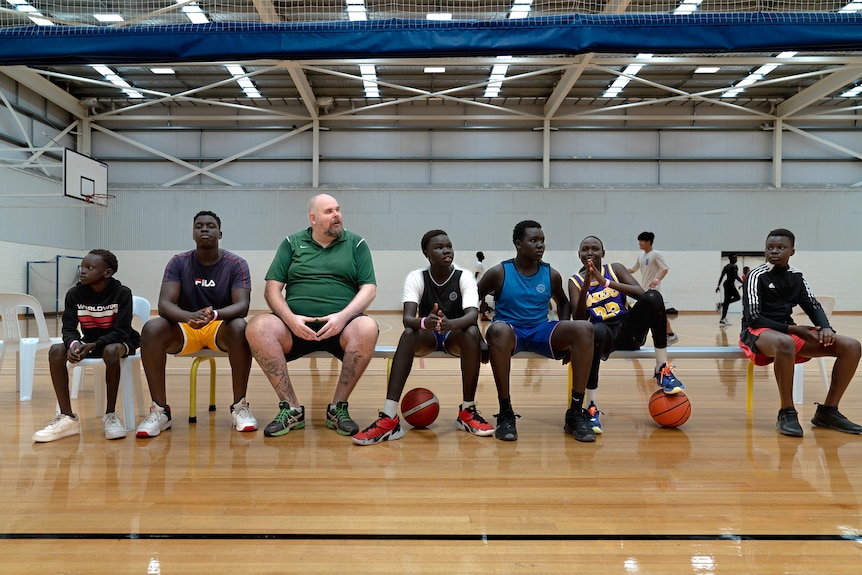 Coach Daniel Nelson with players