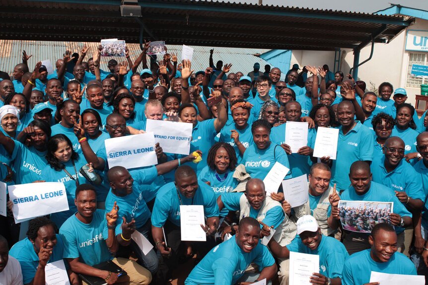 Staff from Unicef receive certificates for responding to the Ebola crisis.