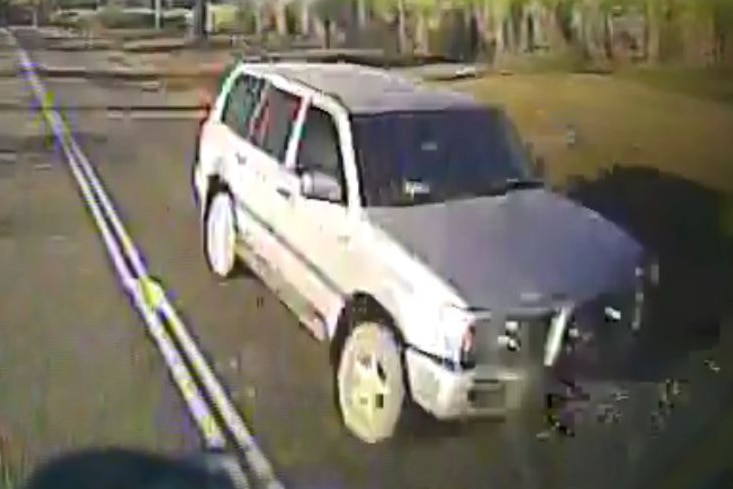 Dash cam footage of a four-wheel-drive on the road.