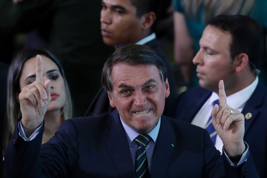 Brazil's President Jair Bolsonaro gestures during an event.