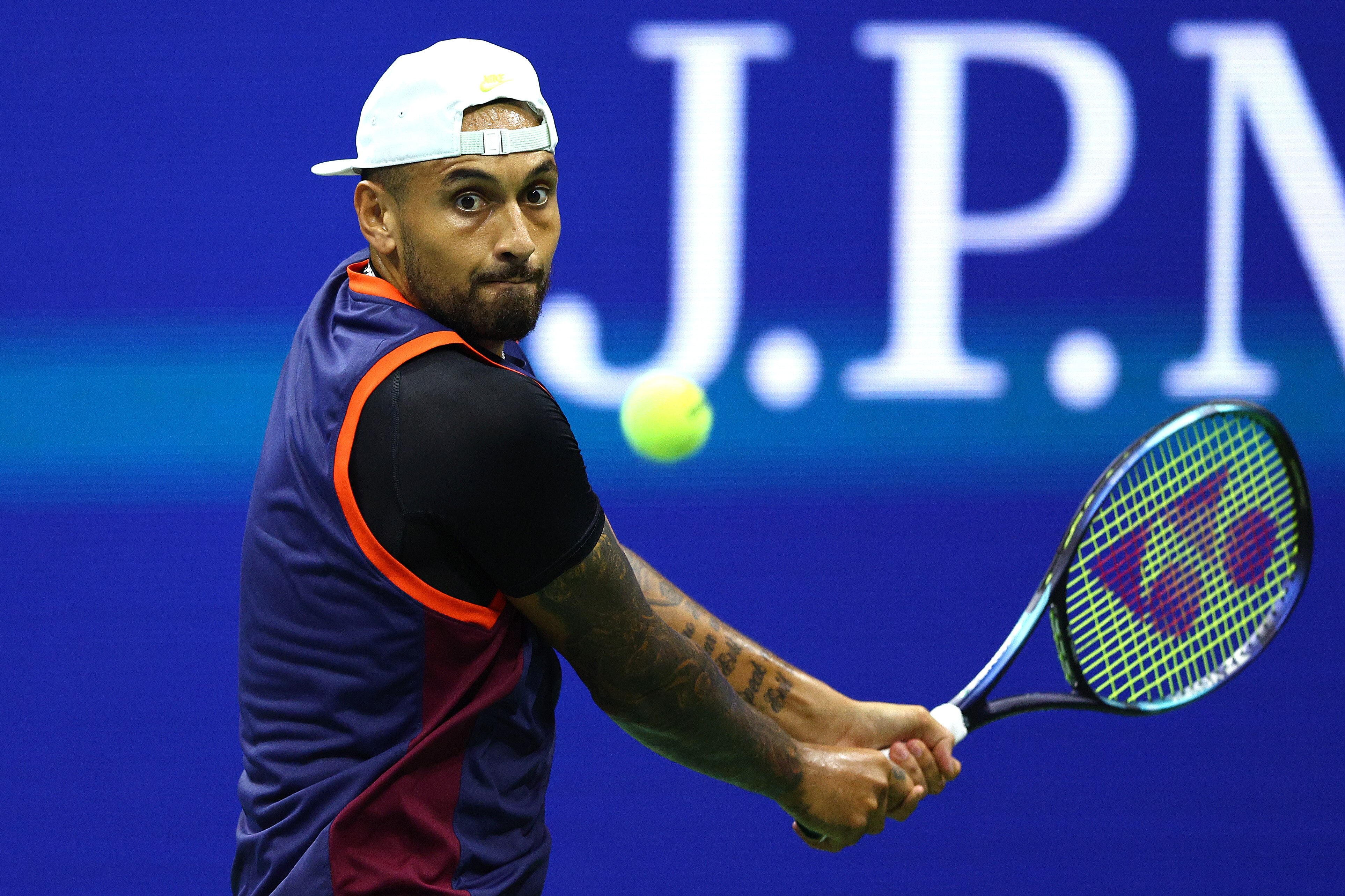 An Australian male tennis player prepares to hit a double-handed backhand at the US Open.