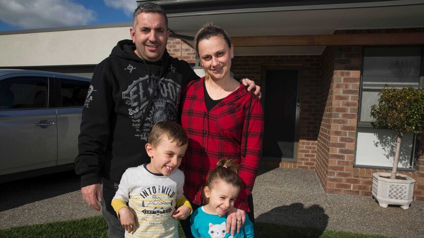 Paul Hili, pictured with his wife Lydia and kids Jake and Tiana at the front of their home